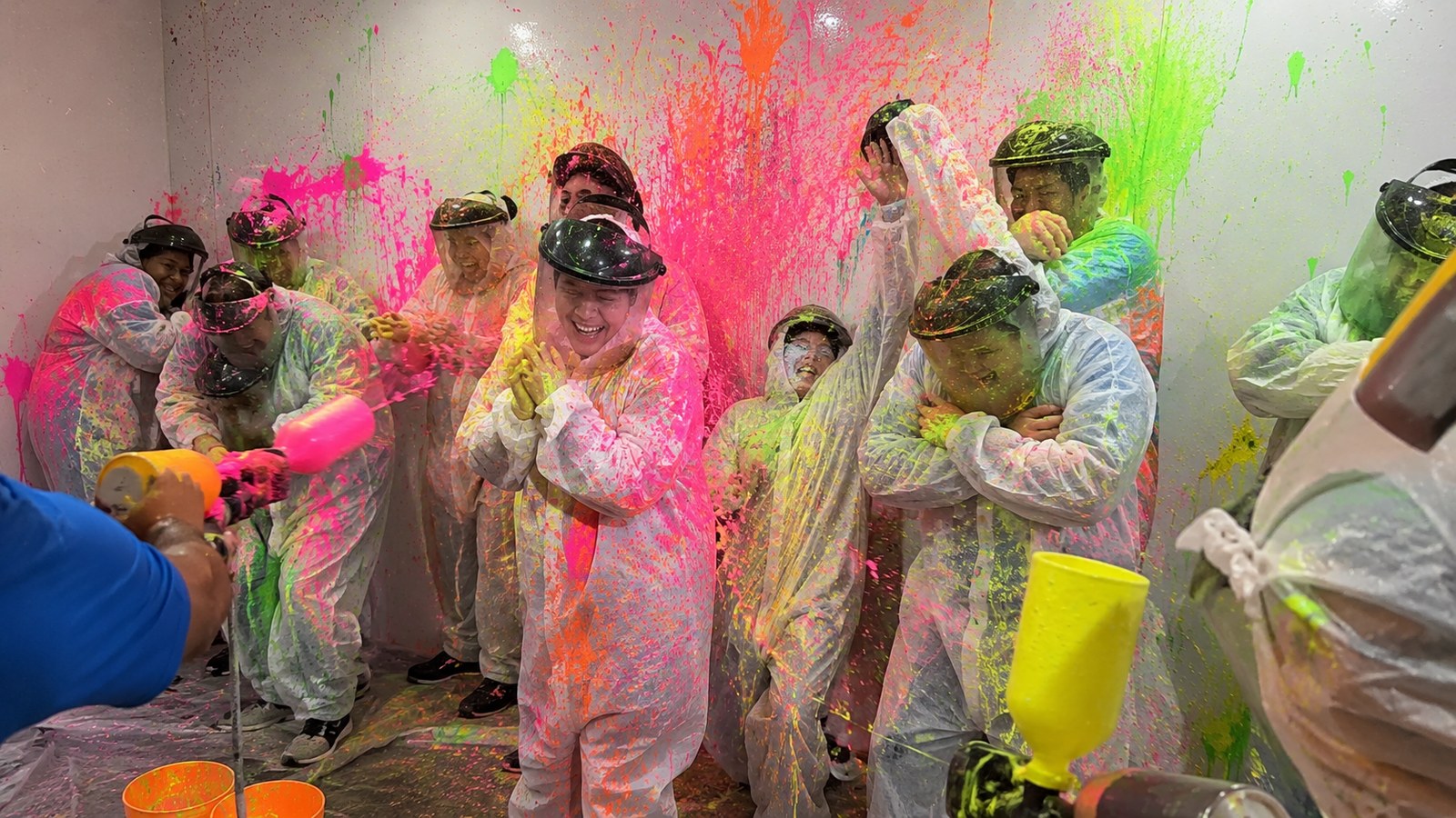 Paint Bomb City Threat Neon team building activity with neon paint and protective suits